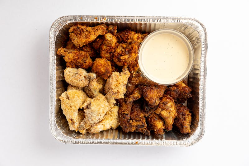 Spicy chicken wing basket with signature starbird sauce