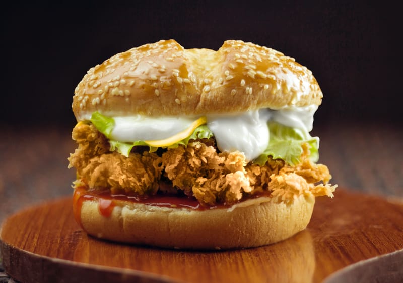 Crispy chicken sandwich with fresh toppings and golden bun