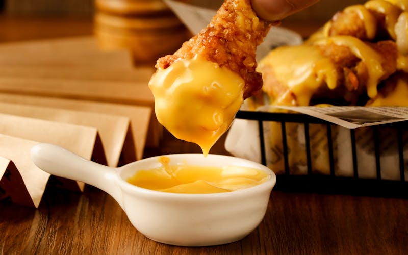 Golden chicken tenders platter with dipping sauces